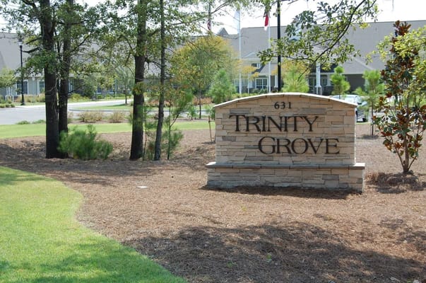 Stone sign of Trinity Grove senior living facility