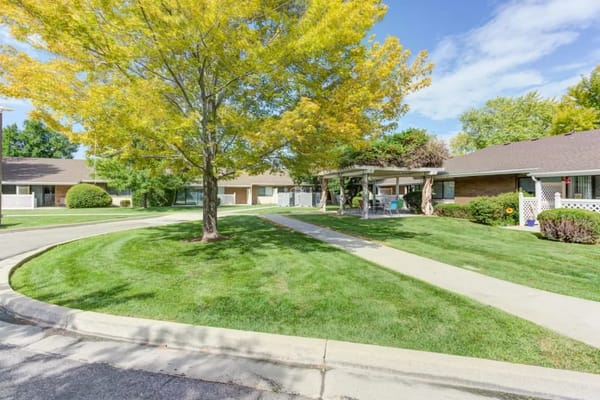 Well-maintained outdoor space with walking paths and trees