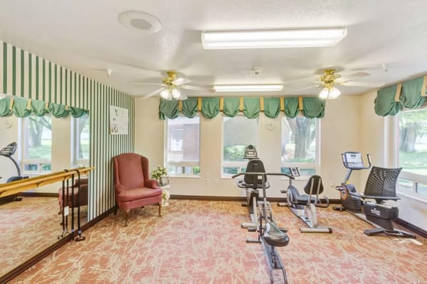 Exercise room with equipment and natural light