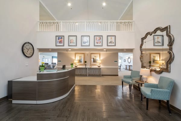 Lobby area with reception desk and seating at Trustwell Living Cherryvale Place
