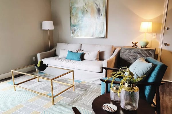 Stylish living room with a sofa, armchair, and coffee table