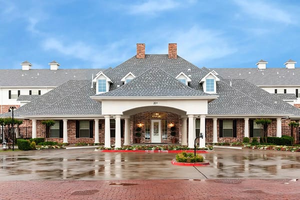Front entrance of Twin Rivers Senior Living facility with a covered porch.