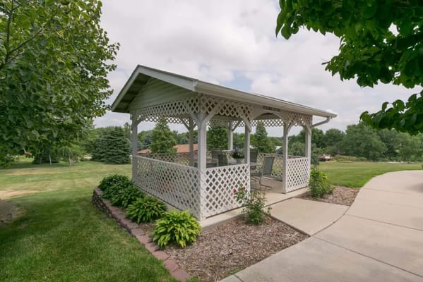 Outdoor gazebo in a landscaped area
