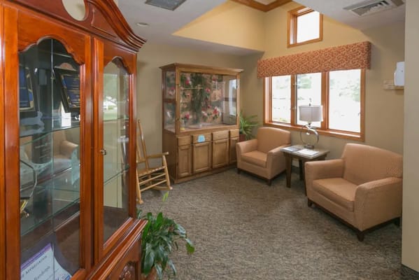Cozy common area with seating and display cabinet