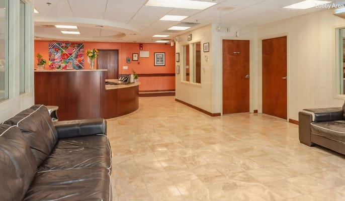 Reception area with seating and decor at Unique Rehabilitation & Health Center