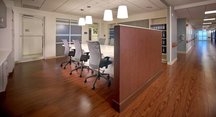 Bright and modern common area with a large table and chairs