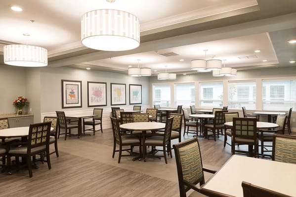 Bright dining area with tables and chairs