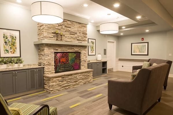 Bright common area with seating and artwork