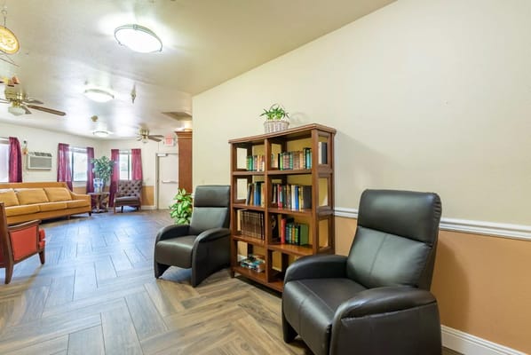 Cozy living room with seating and bookshelves