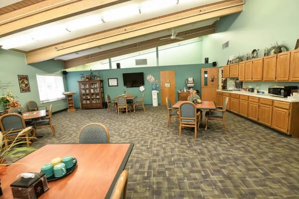 Common area with tables and kitchenette