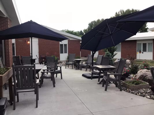 Outdoor seating area with umbrellas and tables