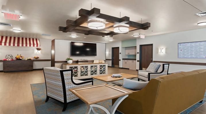 Interior common area with seating and a television