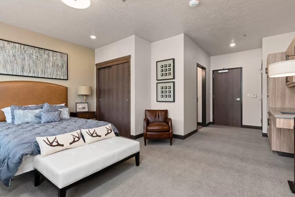 Cozy resident room with a bed and seating