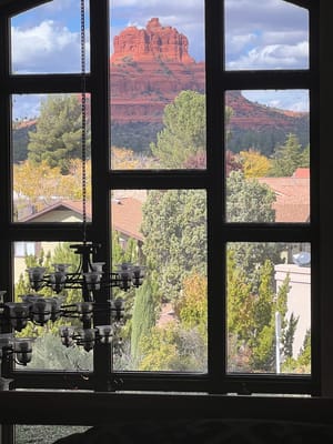 View of red rock formations through a large window