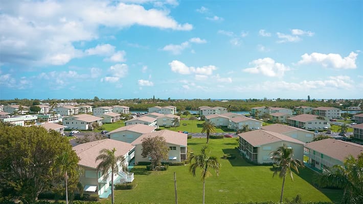 Aerial view of a senior living community with landscaped areas
