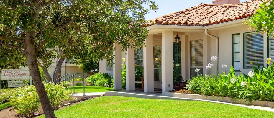 The front entrance of Villa Alamar surrounded by lush greenery