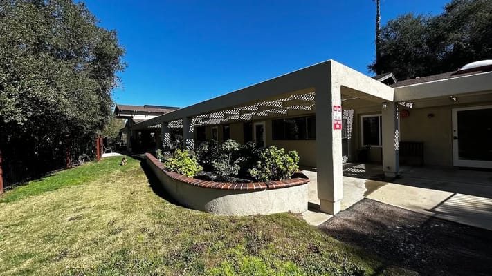 A view of the outdoor patio with greenery at Villa Bernardo.