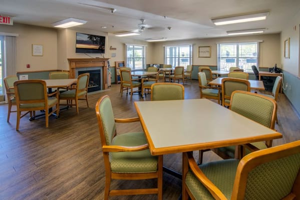 Spacious common area with tables and chairs