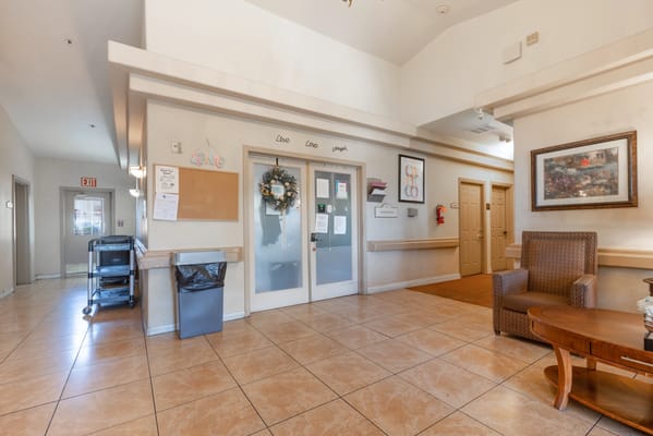 A bright lobby area with seating and decorations