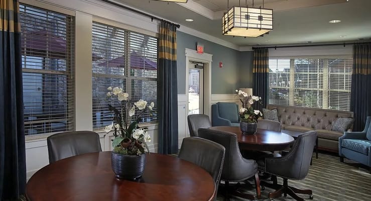 Cozy lounge area with comfortable seating and large windows