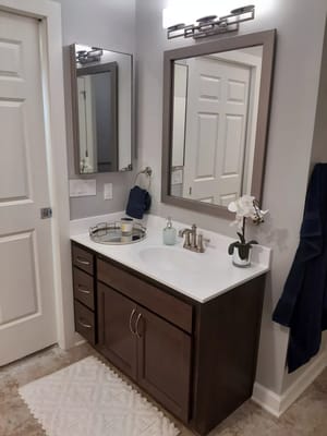 Modern bathroom vanity with mirrors and decorative touches