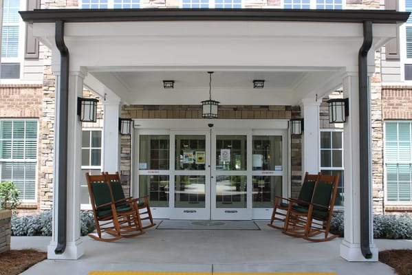 Front entrance with rocking chairs at The Villas at Canterfield