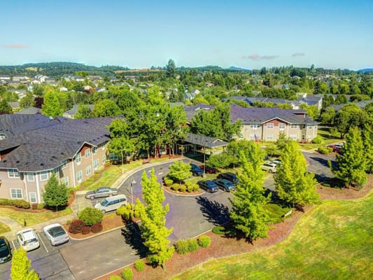 Aerial view of Vineyard Heights Assisted Living surrounded by landscaped grounds.