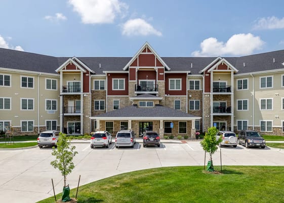 Front view of the Vintage Cooperative of Ames building with parked cars.