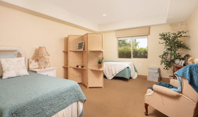 Cozy and inviting resident bedroom with natural light