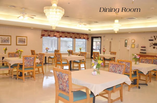 Bright and inviting dining room with floral centerpieces