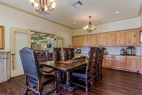 Large dining area with wooden table and chairs