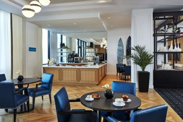 Dining area with tables, chairs, and food options