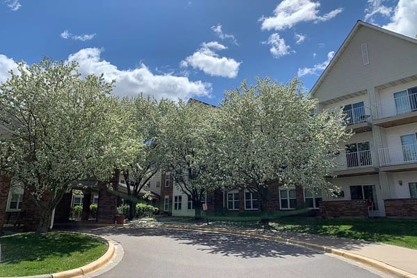 Blossoming trees in front of the Walker Methodist - Westwood Ridge facility