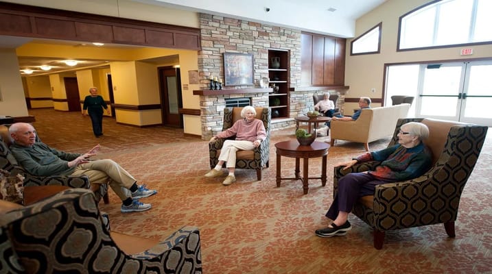 Residents enjoying time in a cozy living room setting