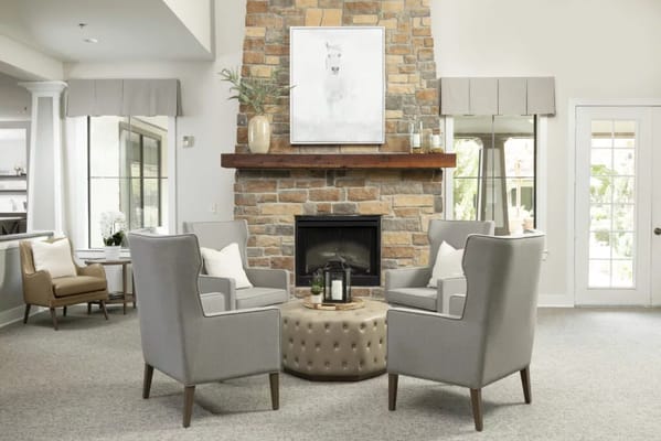 Cozy common area with seating by the fireplace