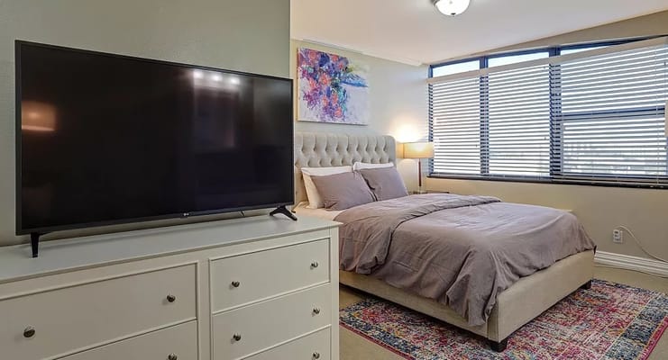 Cozy bedroom with a comfortable bed and television