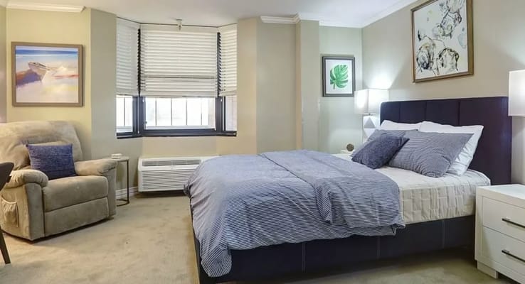 Well-furnished bedroom in a senior living facility
