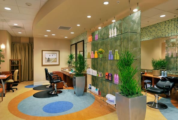 Interior of the salon with hair styling stations and product displays