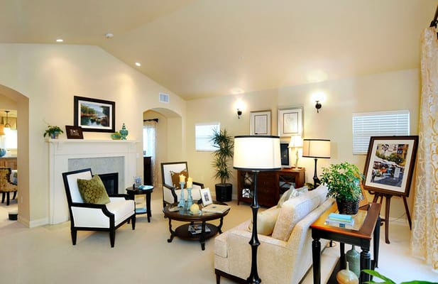 A cozy living room with comfortable seating and decorative items.