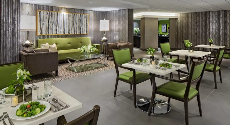Elegant dining area with green accents and food setup