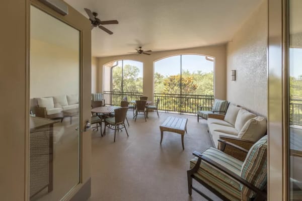 Bright indoor common area with seating and large windows