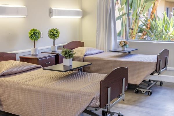 Bright interior of a shared resident room with beds