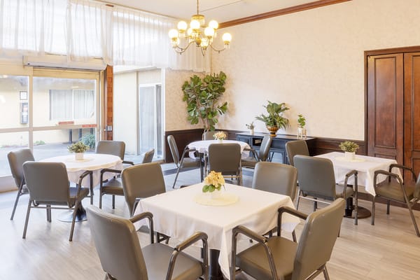 Bright dining area with tables and chairs