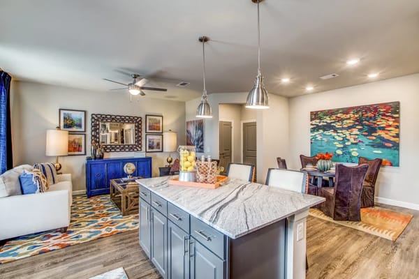 Modern kitchen and living space with stylish furnishings