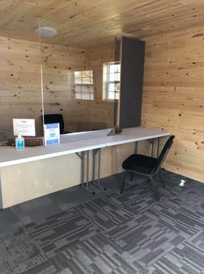 Interior view of reception area with a table and chair