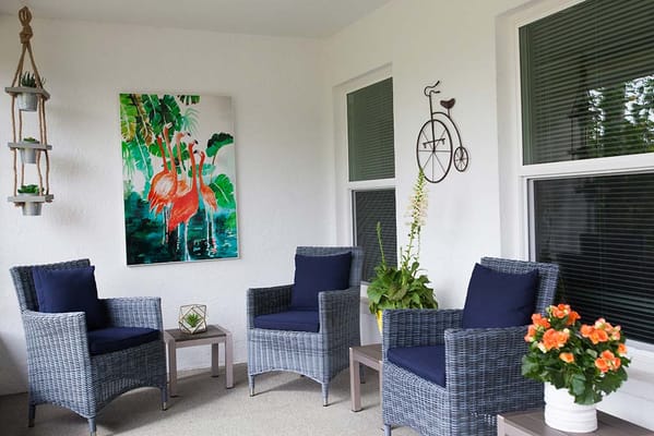 Outdoor seating area with plants and decor
