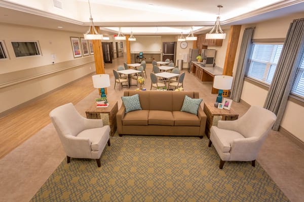 Bright common area with seating and activity space