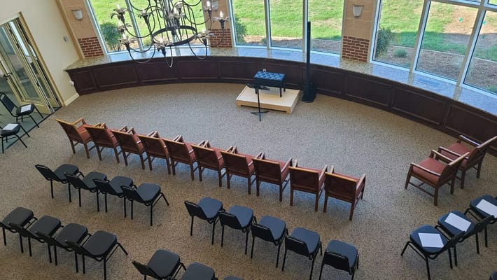 Common area with seating and stage for activities