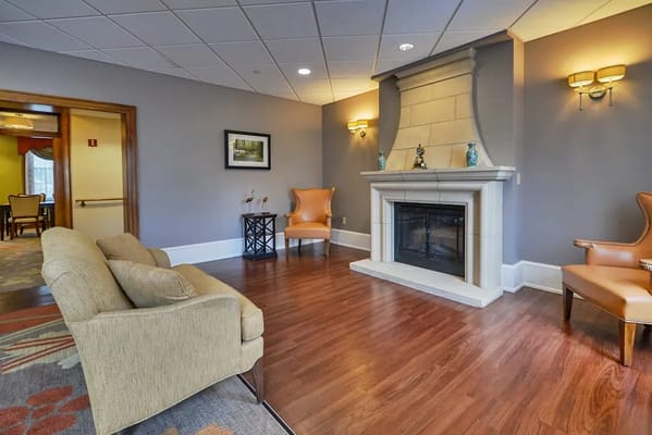 Cozy lounge area with a fireplace and seating