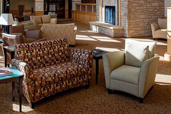 Interior seating area with couches and a fireplace